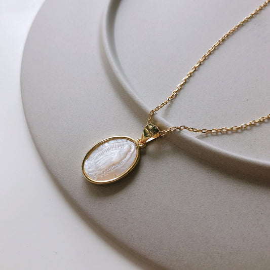 Delicate Gold Virgin Mary Pendant Necklace in 925 Sterling Silver with Shell Accent – A timeless blend of faith and elegance in religious jewelry.