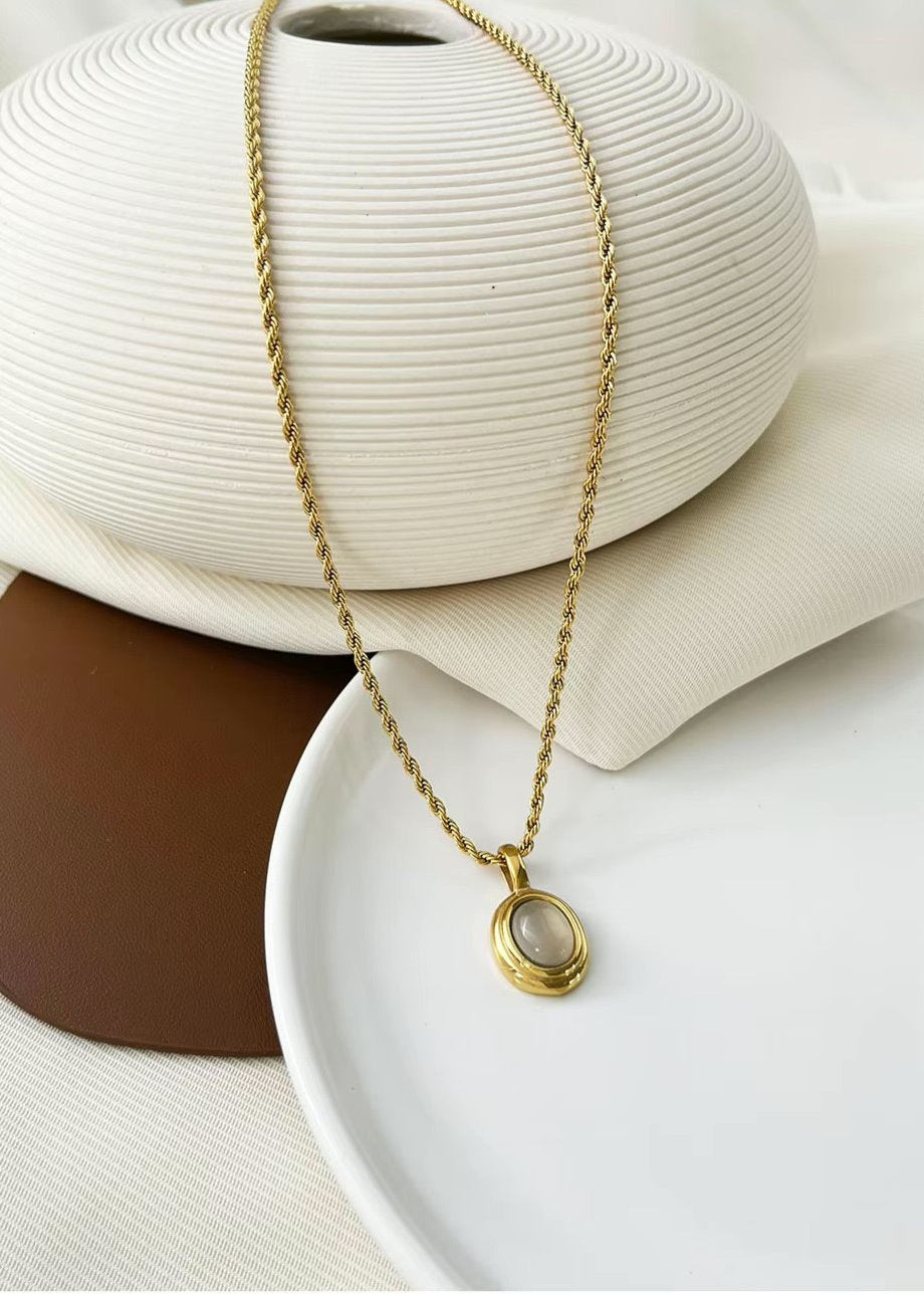 18K gold plated oval pendant necklace in stainless steel with minimalist design, perfect for layering or everyday wear.