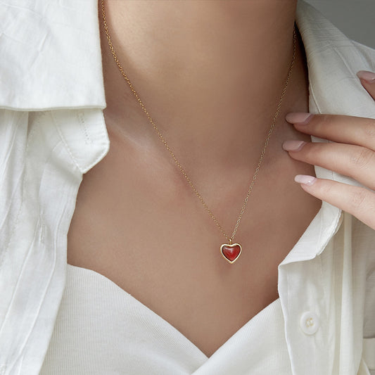 Stainless steel necklace with heart-shaped red agate pendant, a symbol of love and elegance.