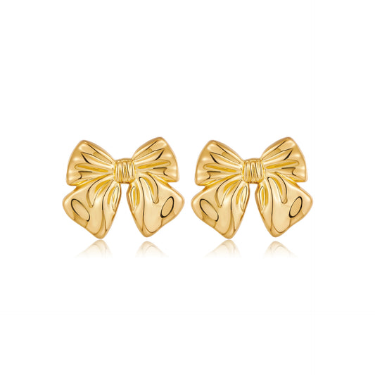 Close-up view of Vintage Gold Bow Earrings on a white background, showcasing intricate design and timeless elegance for women's fashion.