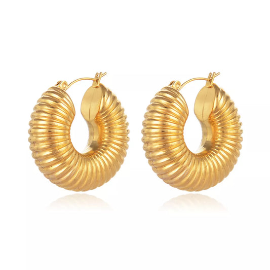 Bold and glamorous, our Gold-Plated Stainless Steel Chunky Hoop Earrings redefine modern elegance for a chic and sophisticated look.
