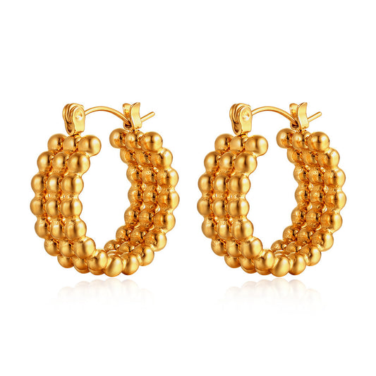 Simple gold stud earrings on model — PURAJOIA