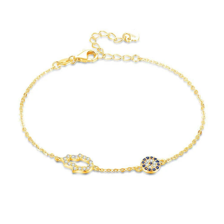 Sterling silver bracelet featuring a Blue Evil Eye Hamsa Hand charm adorned with Cubic Zirconia accents for a stylish and protective accessory