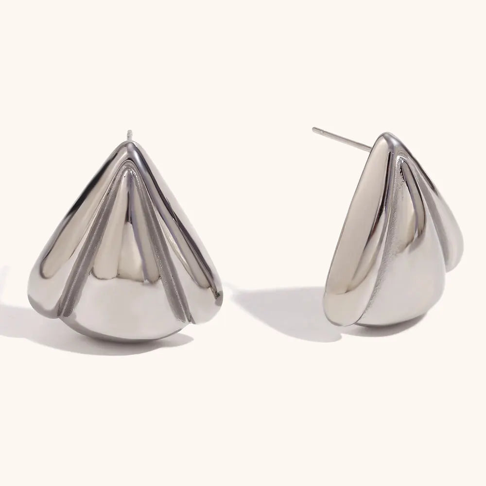 Pair of silver teardrop-shaped earrings on a white background