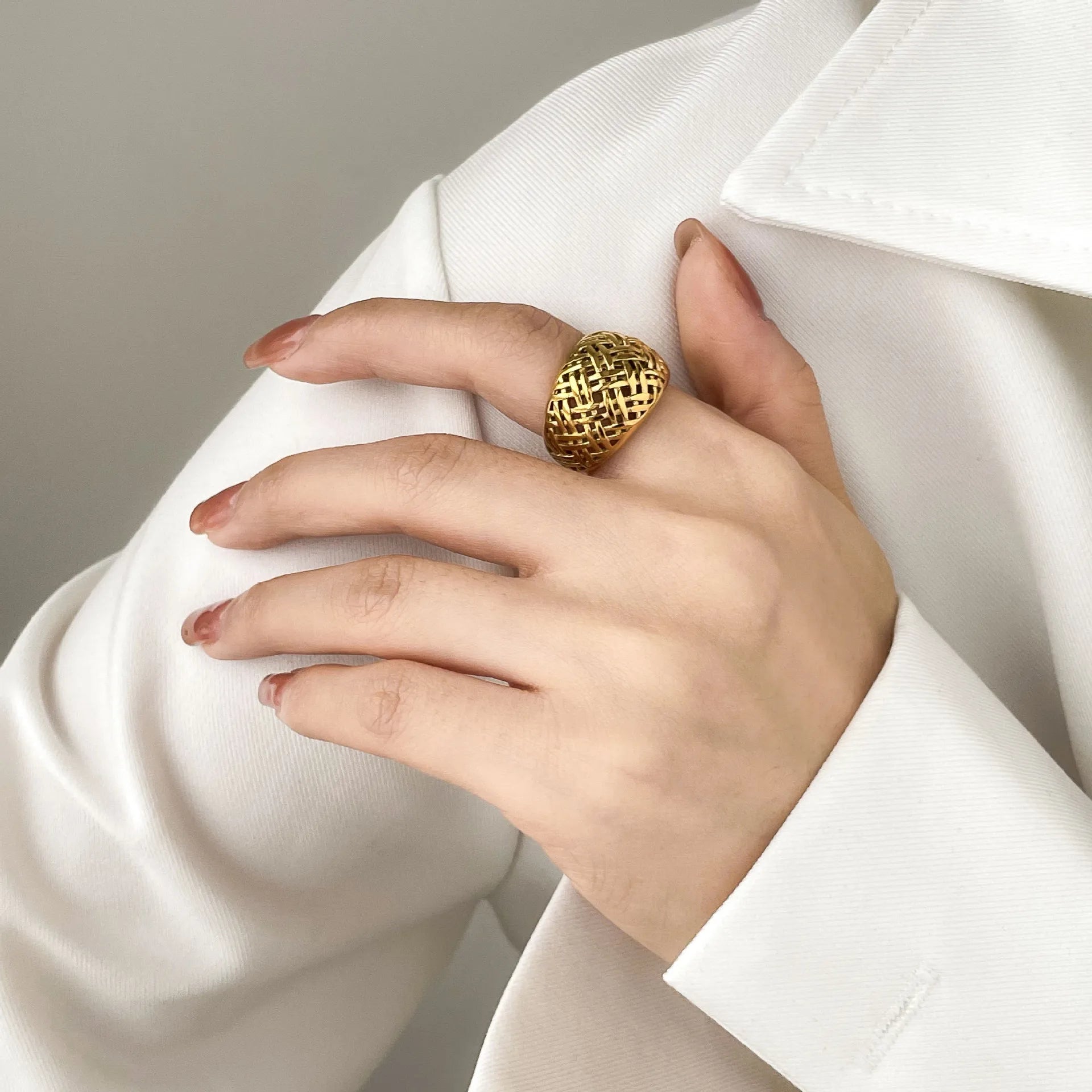 Intricate braided design ring crafted in stainless steel gold finish