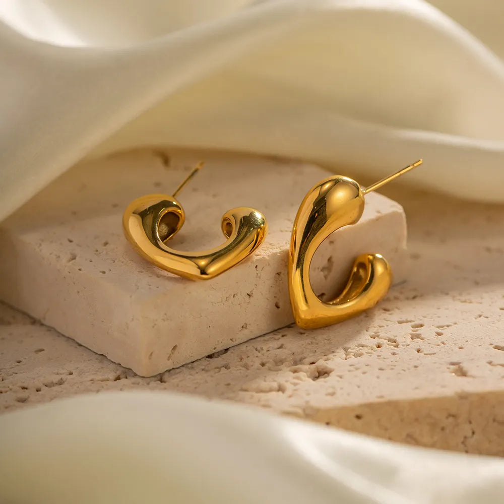 Timeless stainless steel hoop earrings with geometric heart design