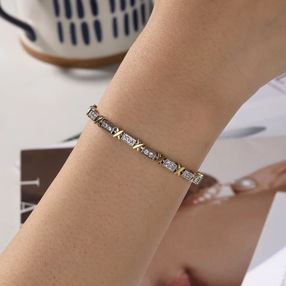 Gold bracelet with diamonds on a wrist, blurred background