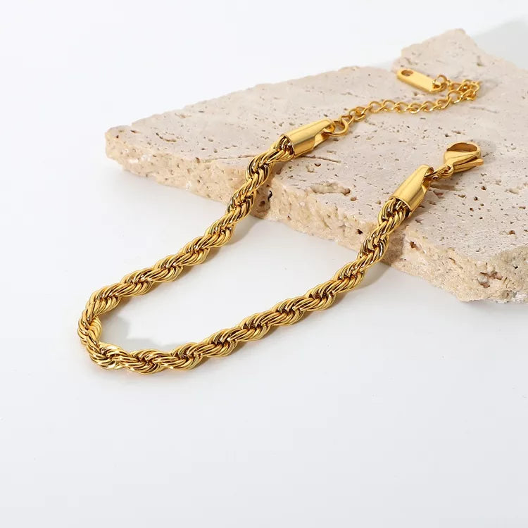 Twist Bracelet in Gold, a trendy and versatile addition to your collection - perfect for stacking and layering.