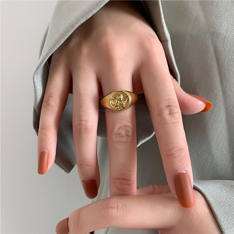 Elegant angel ring wide design crafted in stainless steel with gold plating