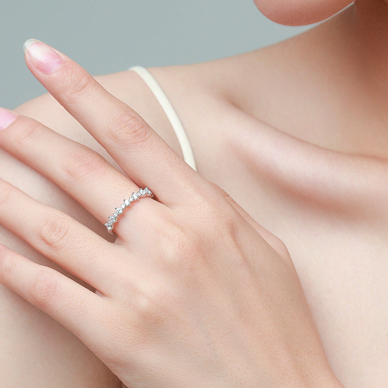 Elegant sterling silver ring with irregular cubic zirconia design