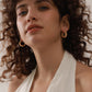 Simple gold stud earrings on model — PURAJOIA