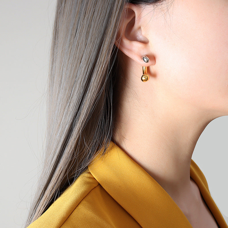 Stainless steel C-shaped earrings with a contemporary two-tone splicing design, blending style and durability for a versatile and elegant accessory