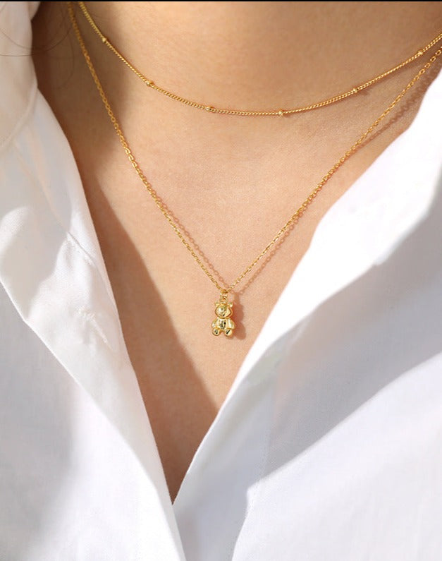 Dainty Gold Peace Bear Necklace - A harmonious blend of charm and tranquility, featuring a gold vermeil pendant on cable chains, adorned with a cute silver bear.