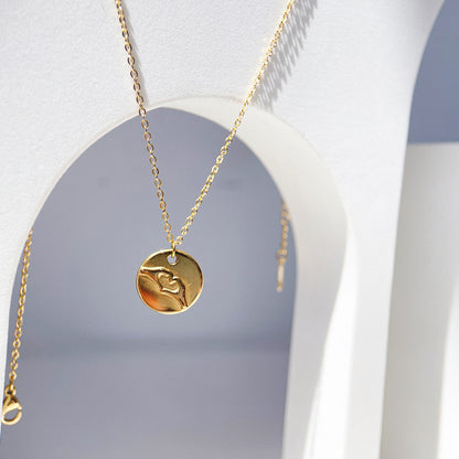 Gold-plated stainless steel round medal pendant necklace symbolizing unity and grace, a timeless accessory for elevated style.