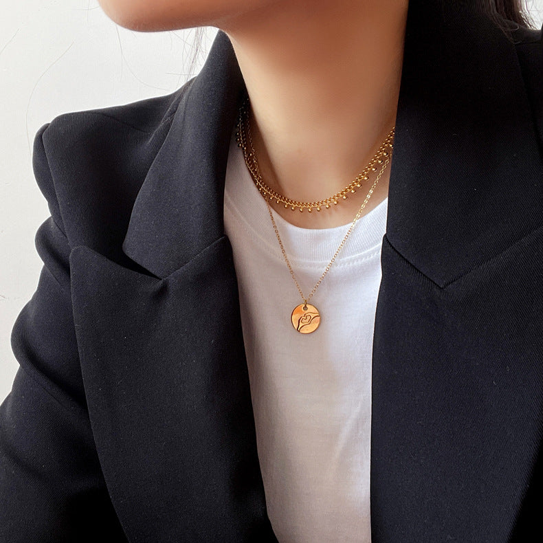 Gold-plated stainless steel round medal pendant necklace symbolizing unity and grace, a timeless accessory for elevated style.