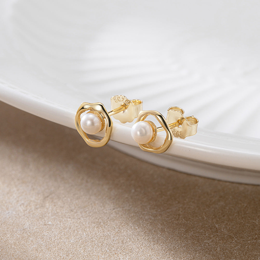 Close-up view of Sterling Silver Freshwater Pearl Ear Studs, showcasing timeless elegance with lustrous pearls set in sterling silver.