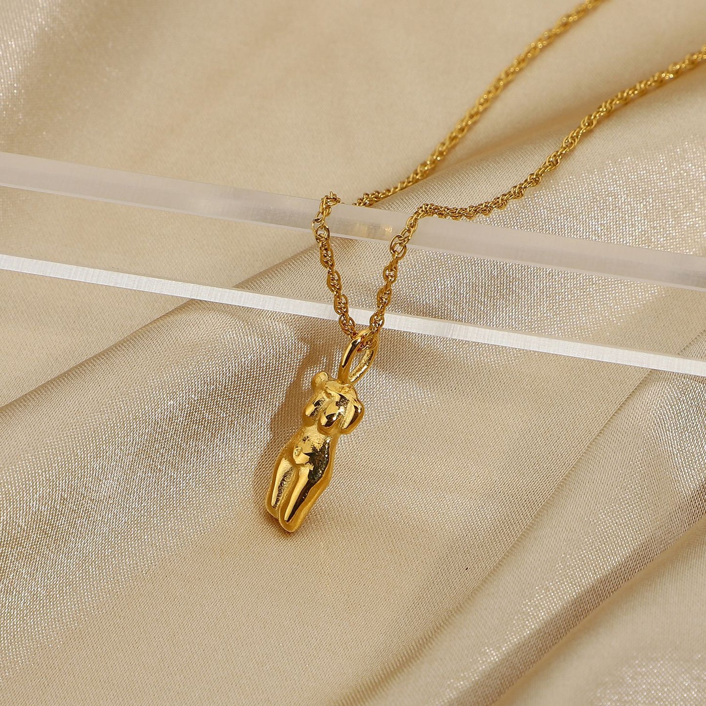 stainless steel pendant necklace on a delicate chain, embodying modern elegance and durability for versatile fashion.