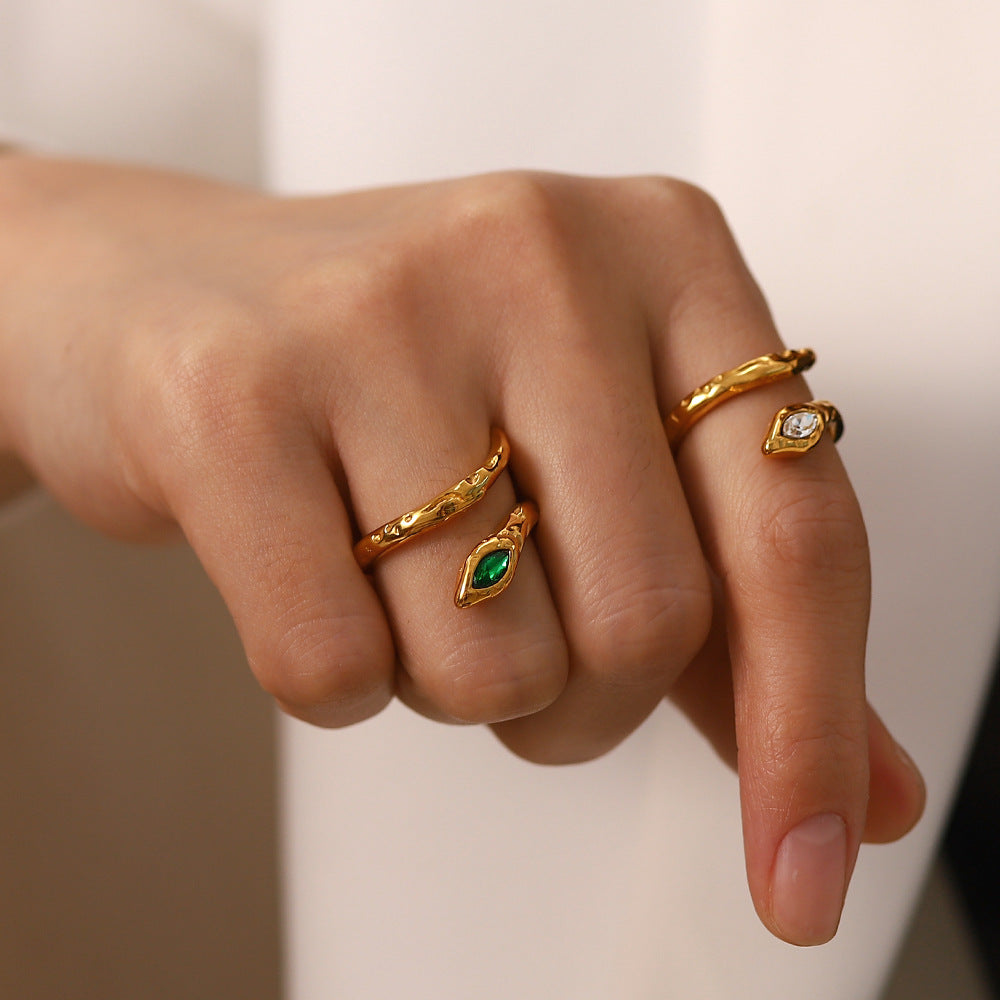 Close-up view of Stainless Steel Snake Shape Crystal Ring with an open gold design, showcasing sparkling crystals, a uniquely alluring accessory for women's elegance.