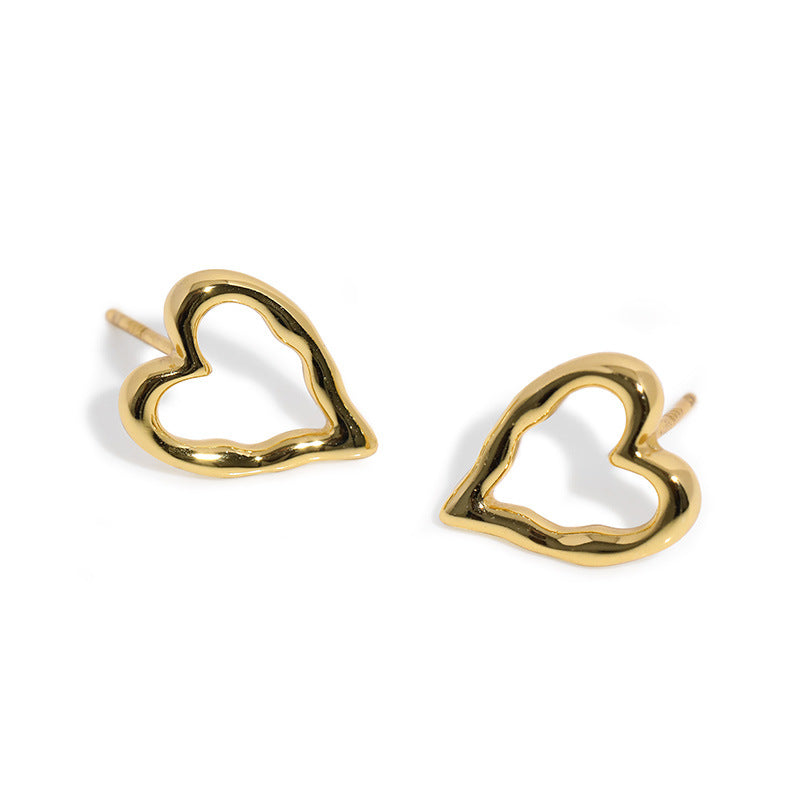 Sterling silver hollow heart ear studs, a modern and elegant accessory.