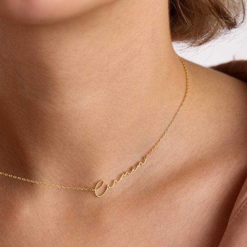 levate your style with our Stainless Steel Custom Signature Necklace—a chic and personalized nameplate jewelry piece for women, blending elegance and individuality effortlessly.