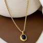 18K gold plated oval pendant necklace in stainless steel with minimalist design, perfect for layering or everyday wear.