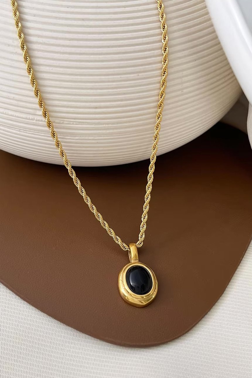 18K gold plated oval pendant necklace in stainless steel with minimalist design, perfect for layering or everyday wear.