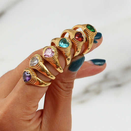 Shiny gold stainless steel ring adorned with colorful stones, a chic accessory for women.