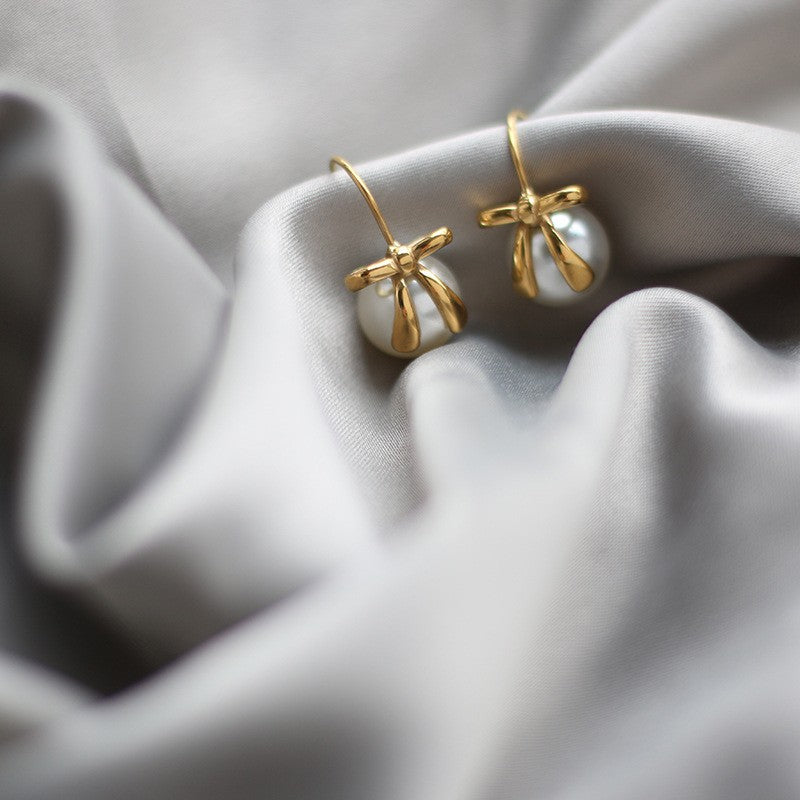 Stainless Steel Gold-Plated Pearl Earrings - A classic and elegant accessory for women, adding a touch of sophistication to any look.