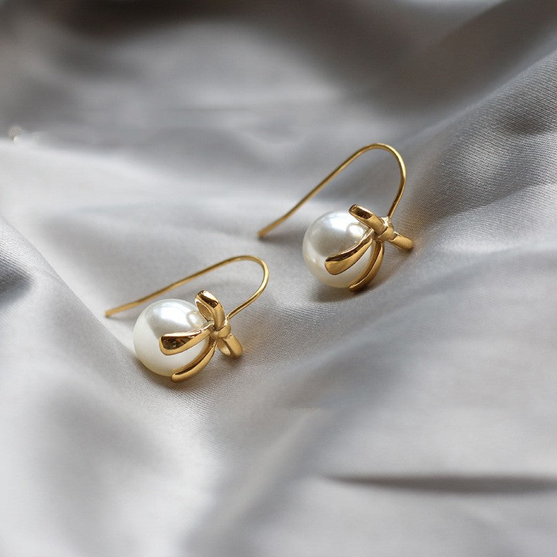 Stainless Steel Gold-Plated Pearl Earrings - A classic and elegant accessory for women, adding a touch of sophistication to any look.