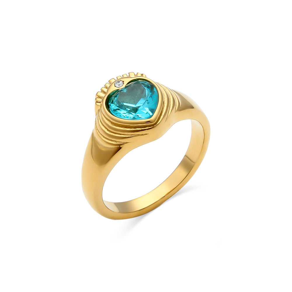 Shiny gold stainless steel ring adorned with colorful stones, a chic accessory for women.