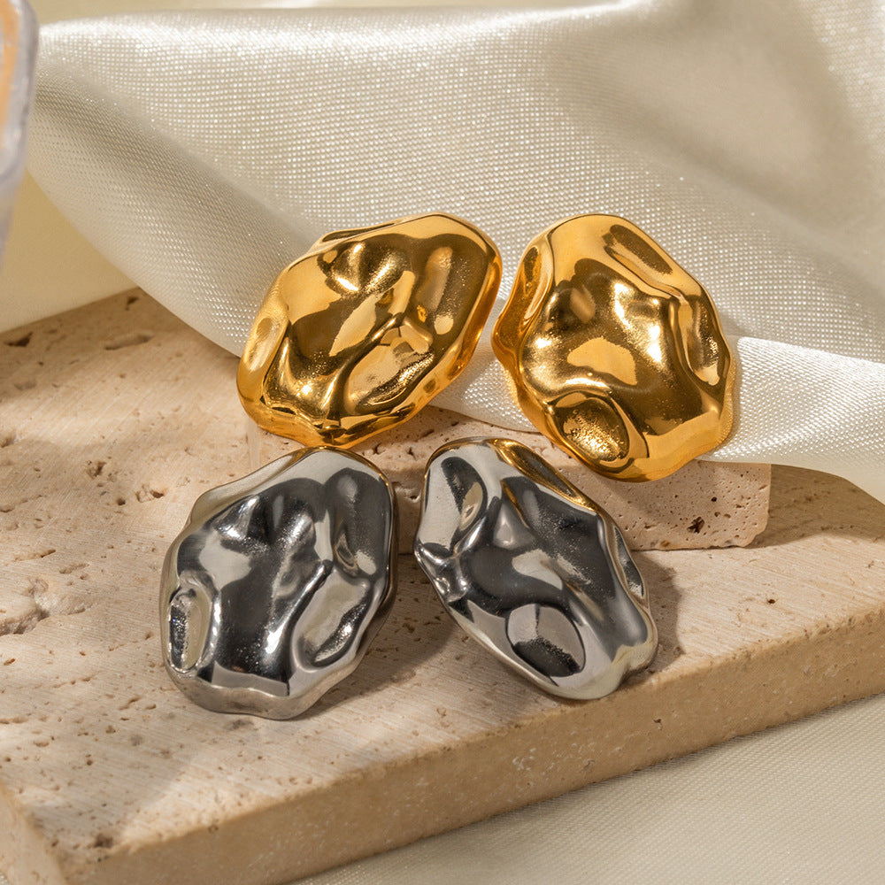 Chic stainless steel earrings featuring an exquisite Twist Lava Textured design, marrying modern flair with timeless sophistication for a bold and unique accessory.