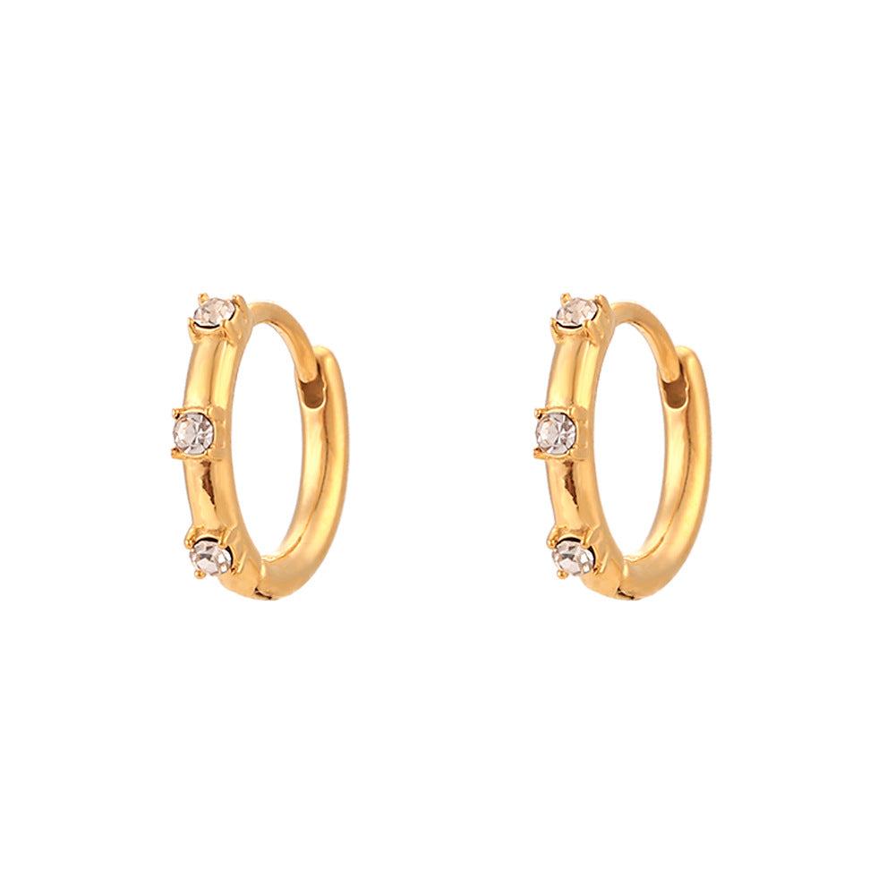 Chic and versatile gold-plated hoop earrings with subtle zircon detailing, adding a touch of timeless elegance to any ensemble.