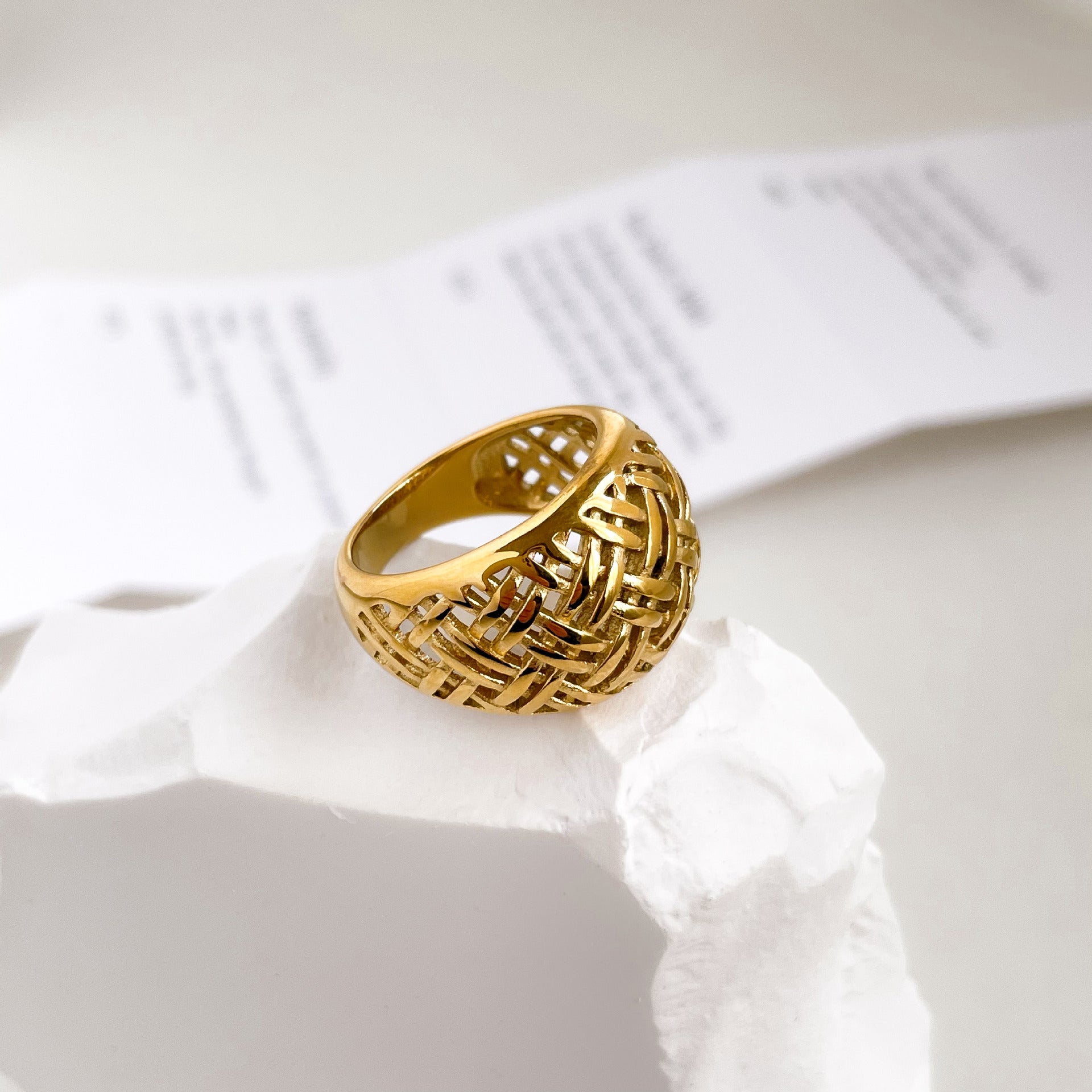 Elegant stainless steel gold-plated braid ring, a harmonious blend of durability and opulence with an intricate design for timeless sophistication.