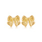 Close-up view of Vintage Gold Bow Earrings on a white background, showcasing intricate design and timeless elegance for women's fashion.