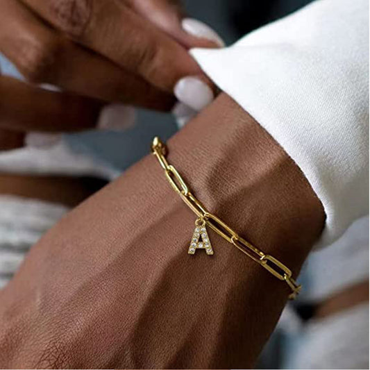 Stainless steel gold-plated bracelet featuring an initial letter charm, a perfect blend of timeless style and personalized elegance