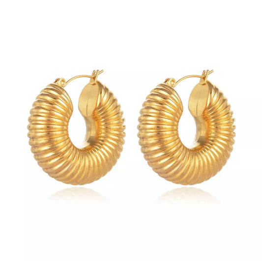 Bold and glamorous, our Gold-Plated Stainless Steel Chunky Hoop Earrings redefine modern elegance for a chic and sophisticated look.