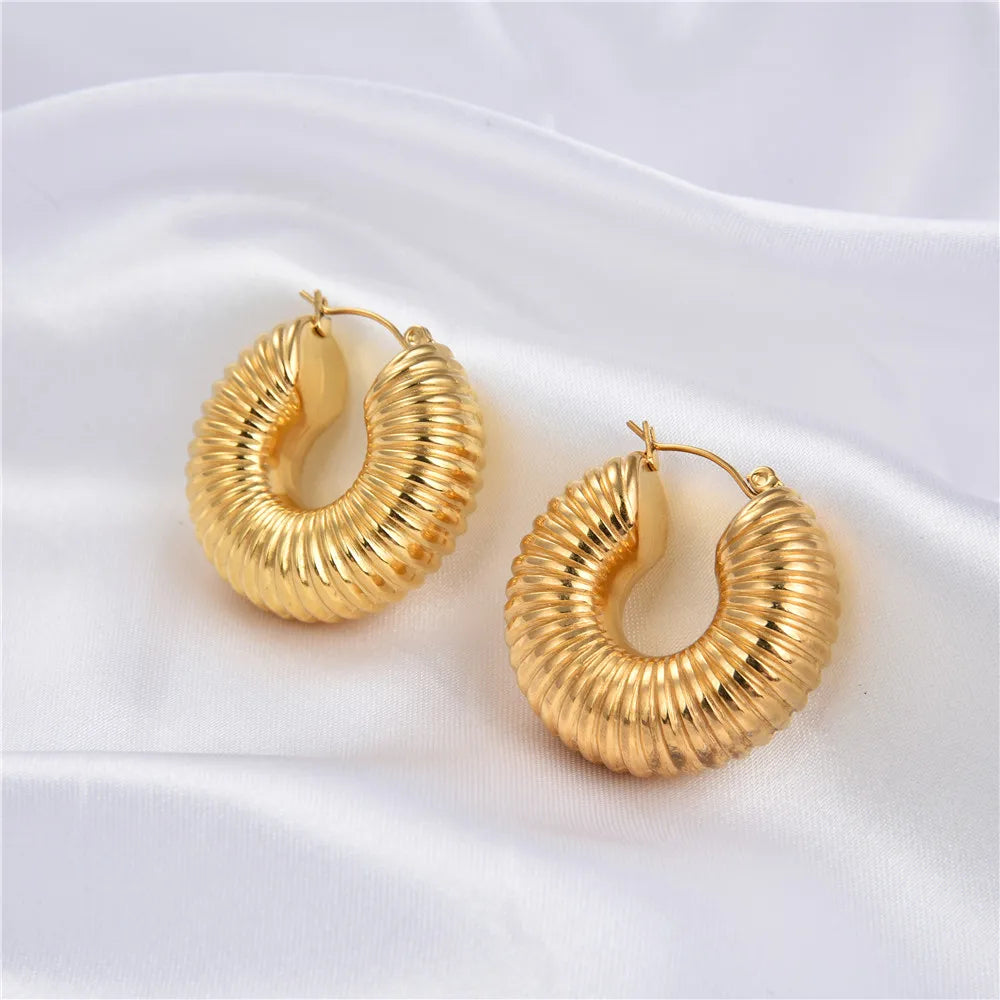 Bold and glamorous, our Gold-Plated Stainless Steel Chunky Hoop Earrings redefine modern elegance for a chic and sophisticated look.