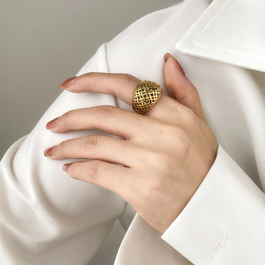 Elegant stainless steel gold-plated braid ring, a harmonious blend of durability and opulence with an intricate design for timeless sophistication.