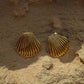 Stylish gold-plated stainless steel earrings with an intricate seashell design, offering timeless elegance and enduring quality.