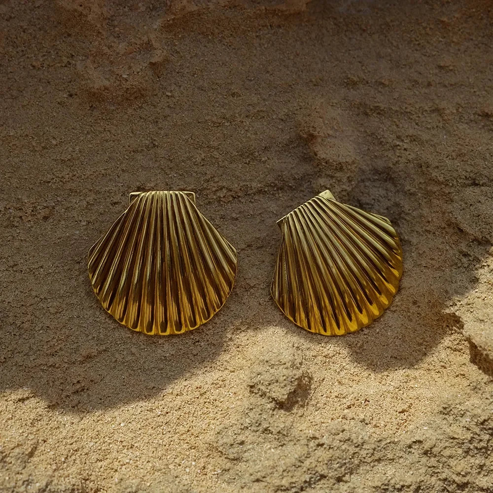 Stylish gold-plated stainless steel earrings with an intricate seashell design, offering timeless elegance and enduring quality.