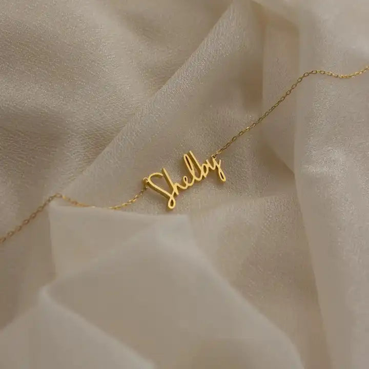 levate your style with our Stainless Steel Custom Signature Necklace—a chic and personalized nameplate jewelry piece for women, blending elegance and individuality effortlessly.