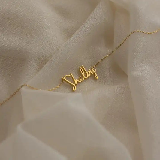 levate your style with our Stainless Steel Custom Signature Necklace—a chic and personalized nameplate jewelry piece for women, blending elegance and individuality effortlessly.