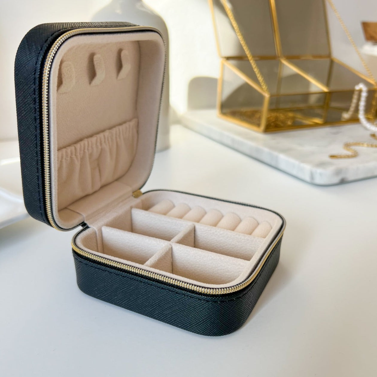 Premium leather jewelry travel case with secure compartments for organized storage, combining style and functionality for on-the-go elegance.