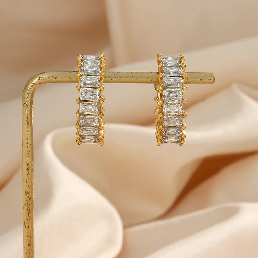 Handmade stainless steel hoop earrings adorned with clear zircon stones, adding a touch of radiance and sophistication to your accessory collection