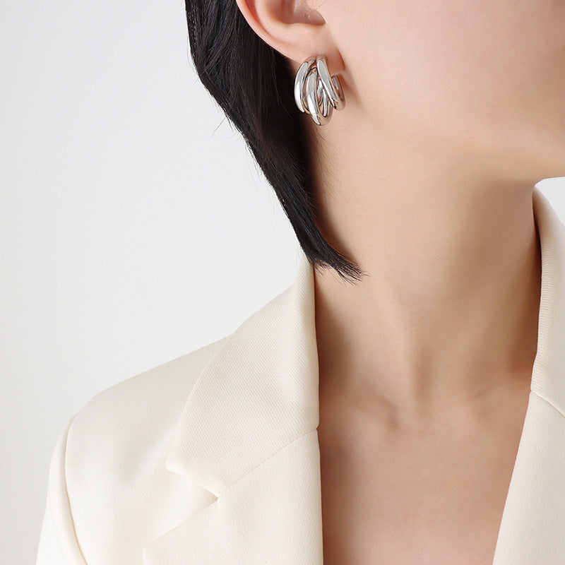 Minimalist three-layer C-shaped earrings, a sleek and versatile accessory for understated elegance.