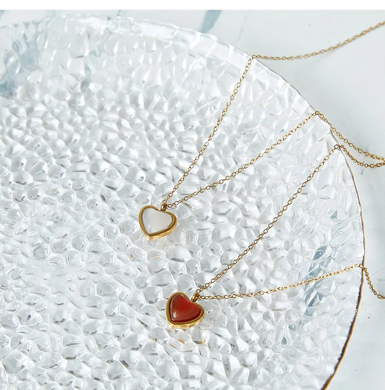 Stainless steel necklace with heart-shaped red agate pendant, a symbol of love and elegance.