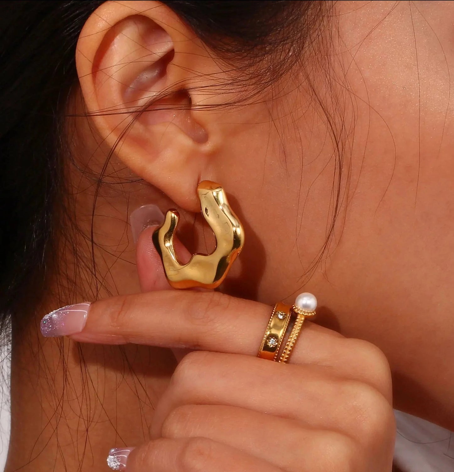 Close-up view of Stainless Steel Chunky C-Shaped Abstract Flower Stud Earrings, showcasing a bold and contemporary design for a statement accessory.