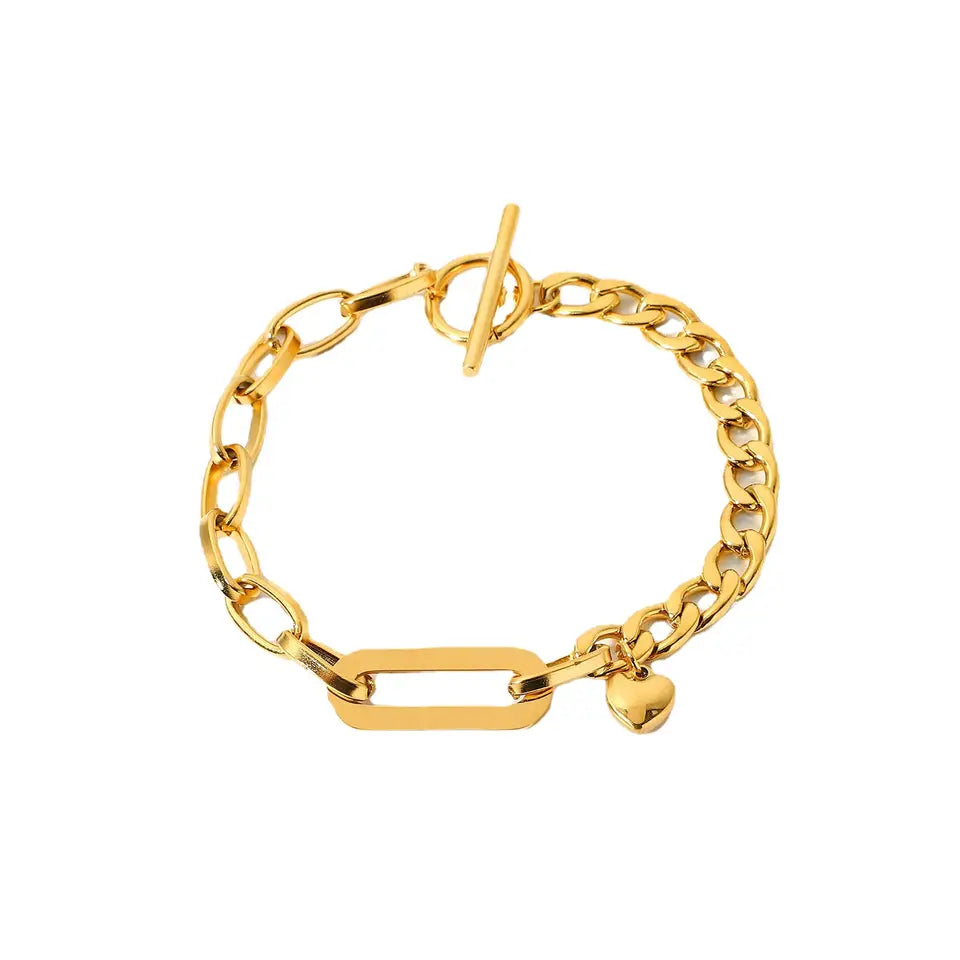 Add a touch of elegance to your jewelry collection with our stunning Oval Link Chain Bracelet with Heart Charm Dangle, expertly crafted by Camco Jewelry. The sleek and modern design is perfect for both casual and formal occasions, and the high-quality materials ensure long-lasting wear and comfort. The heart charm dangle adds a touch of whimsy and romance to this timeless piece. Order now and elevate your style game with this chic and versatile accessory