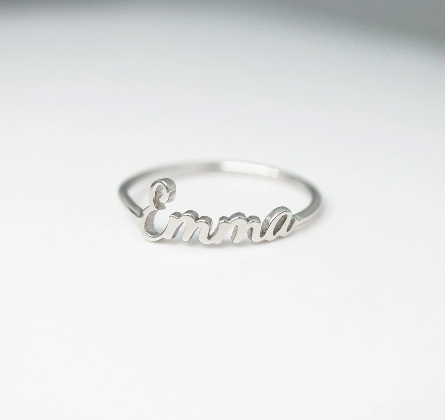 A close-up view of the exquisite Stainless Steel Name Ring, showcasing personalized initials, adding a touch of sophistication to any ensemble.