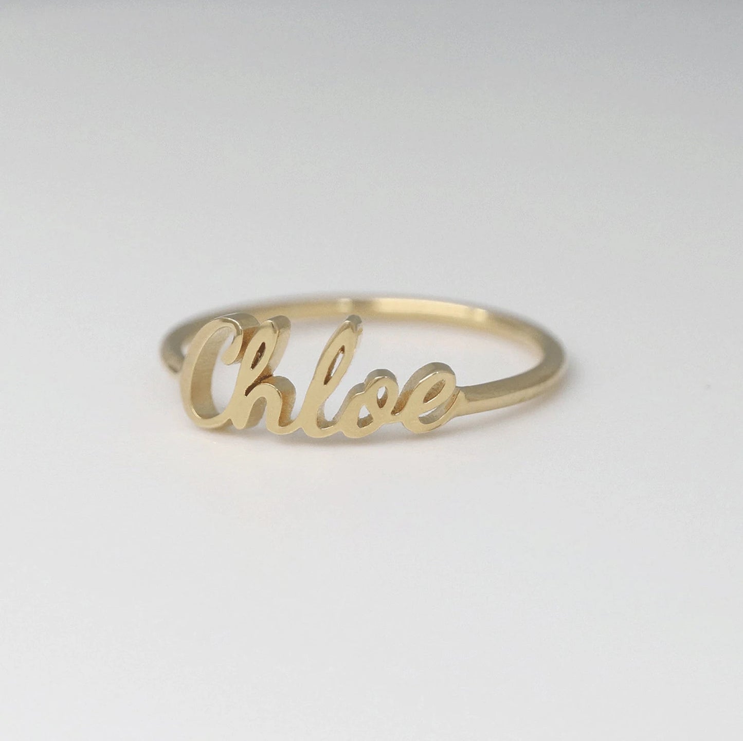 A close-up view of the exquisite Stainless Steel Name Ring, showcasing personalized initials, adding a touch of sophistication to any ensemble.